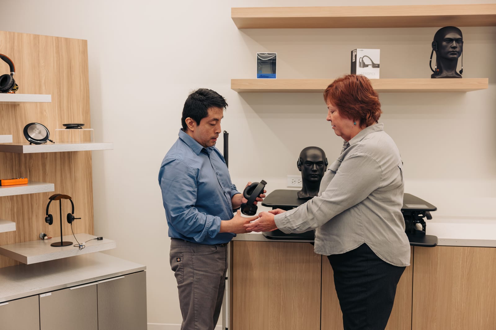 Deb and Israel working together in an accessibility solutions center.